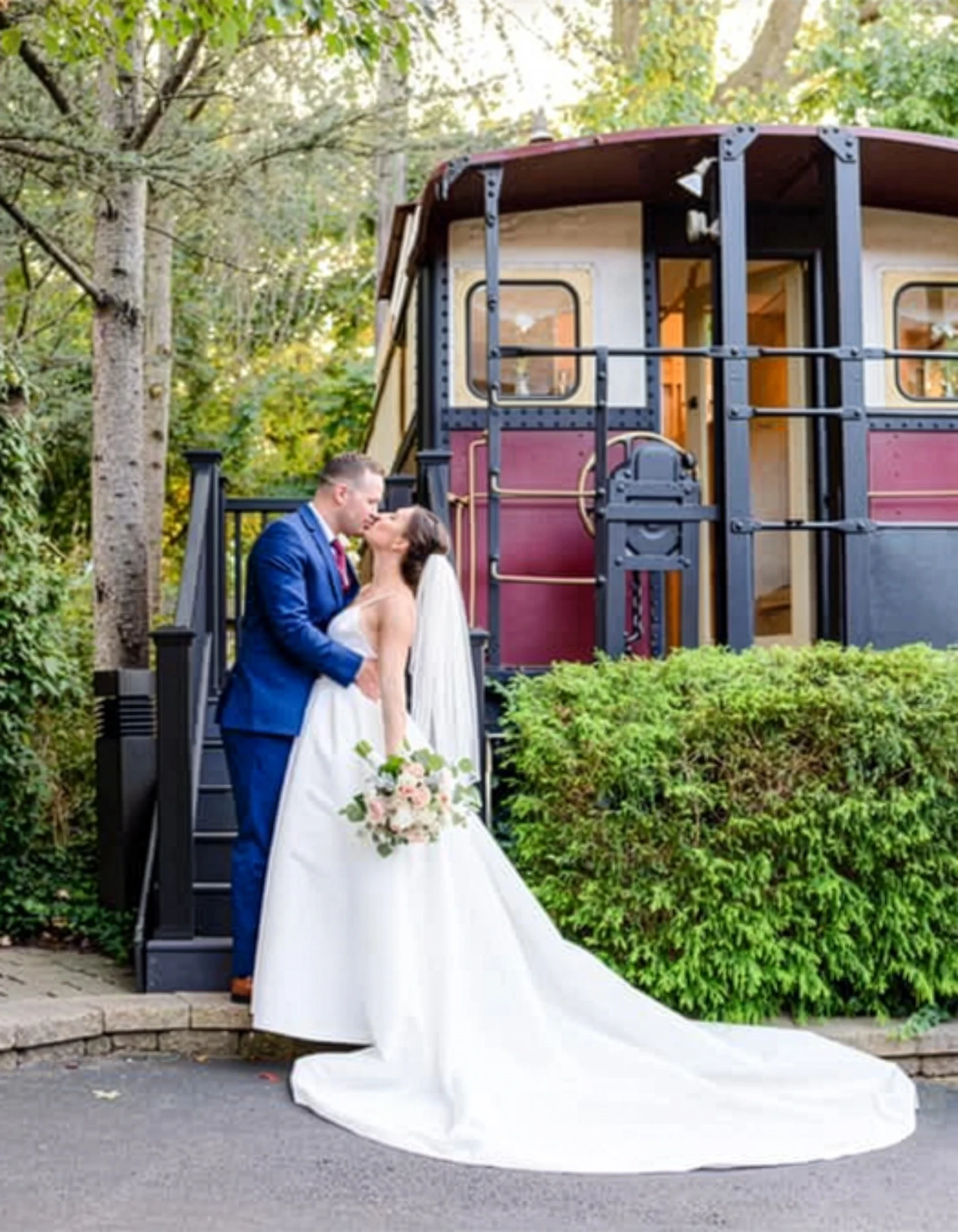 Сouple wearing a white gown and a black suit